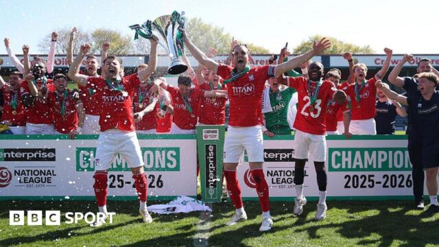 Ollie Pearce and Callum Howe of York City lift the National League Trophy after the 1-1 draw at Rochdale