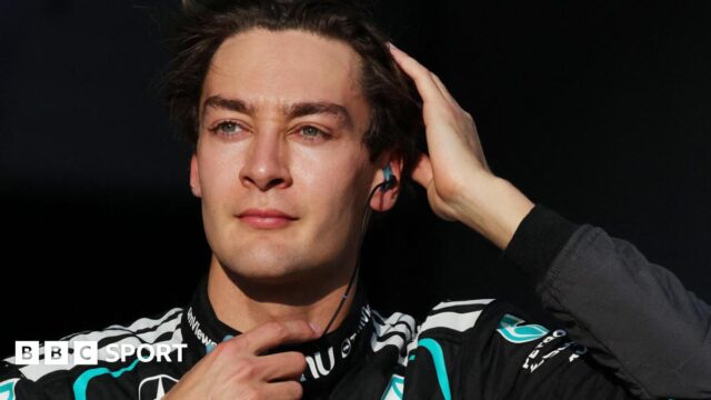 George Russell runs his right hand through his hair as he prepares for the start of the 2026 Japanese Grand Prix